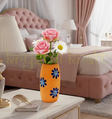 Hand-painted recycled glass bottle featuring elegant blue and white floral designs on a soft pink base — a charming eco-friendly mini vase or pen stand by Krystal Kraft.