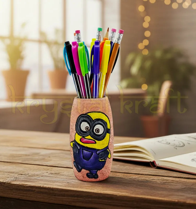 Hand-painted Minion-themed recycled glass bottle with a pink base and blue-yellow accents, designed by Farisa Merchant — a sustainable mini vase or pen stand.