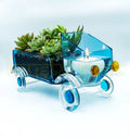 Eco-friendly Bombay Sapphire Truck Bowl handcrafted from recycled glass bottles by Krystal Kraft, featuring a playful truck design for serving snacks or enhancing décor as an elegant artistic centerpiece.
