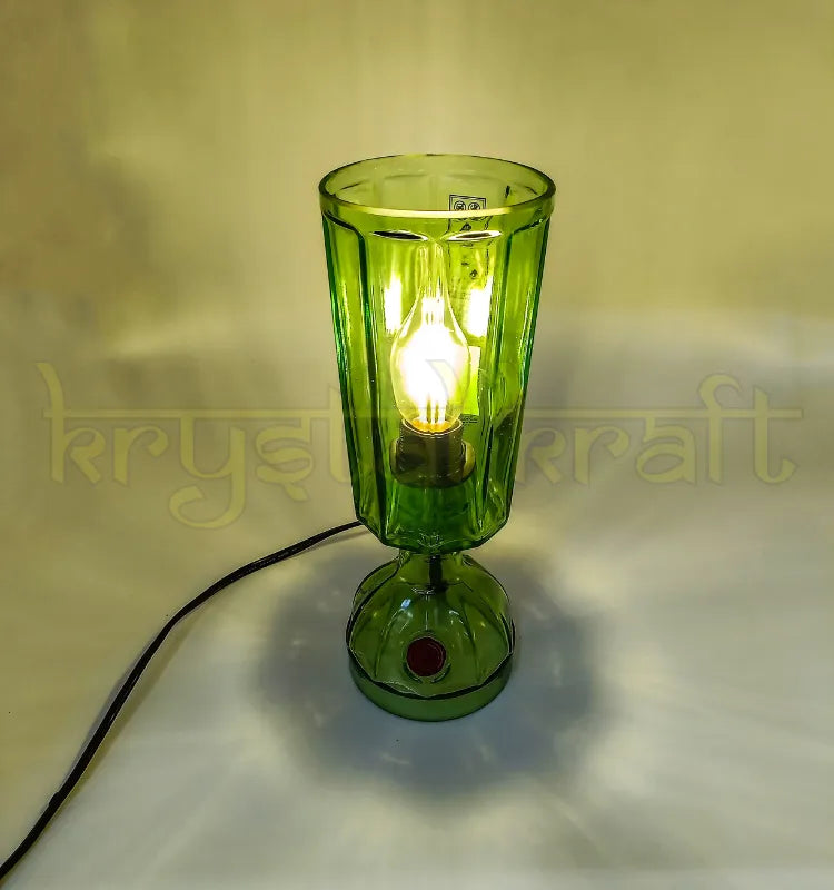 Handmade bottle art table lamp created by a Vadodara artist.