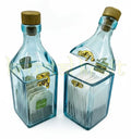 Artistic glass bottle storage canister designed for coins, dry fruits, candies, and candles.