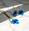 Handmade glass leaf earrings crafted by Indian artisan Shazia Merchant.