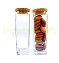 Elegant upcycled Gold Label square glass jars with airtight cork lids, handcrafted by Krystal Kraft for eco-friendly storage of cookies, pulses, and dry fruits.