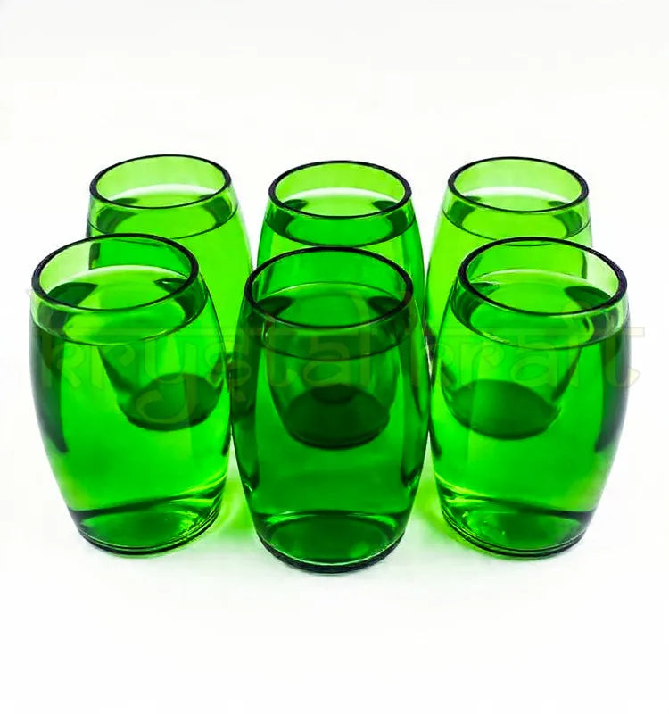 Handcrafted upcycled Perrier glass made from authentic green Perrier bottles with polished rim, eco-friendly sustainable drinkware.