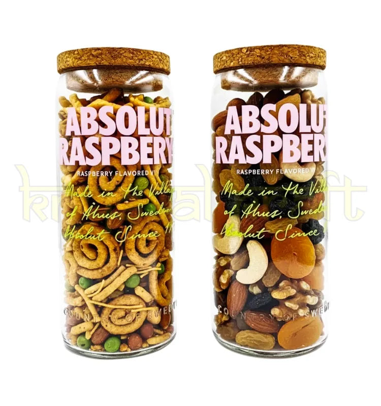 Beautifully handcrafted Absolut Raspberri bottle jars with vibrant pink label and polished finish, ideal for decorative display or stylish snack storage.