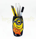 Unique handmade bottle art featuring a Cool Minion design on a black base, painted in bright orange and yellow acrylics — crafted by artist Farisa Merchant.