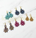 “Set of 5 handmade paper quilling earrings by Krystal Kraft featuring colorful jhumka and stud styles.”