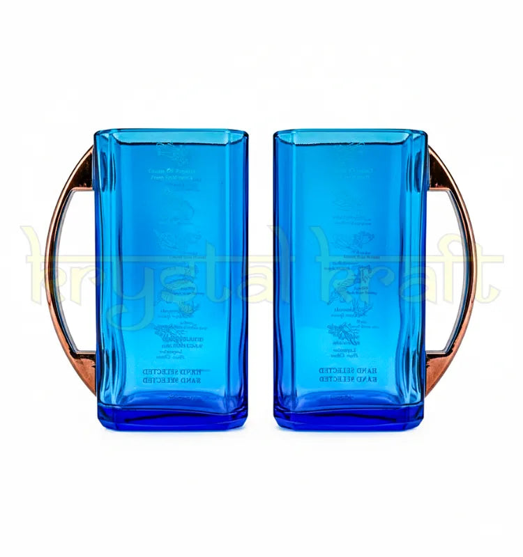 Beautiful pair of handmade mugs crafted from recycled Bombay Sapphire glass bottles, highlighting sustainable upcycled craftsmanship and eco-friendly artistry by Krystal Kraft.