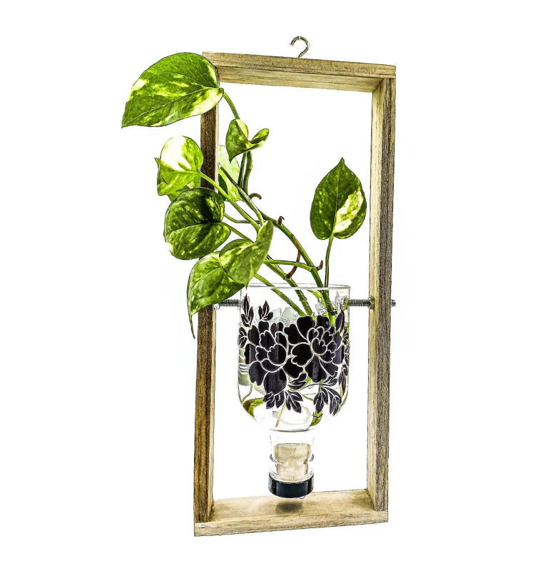 Flower printed upcycled glass bottle hanging planter on wall frame by Krystal Kraft