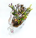 Handmade upcycled glass tricycle planter by Raees Ahmed Merchant, clear with pink accents, eco-friendly home décor