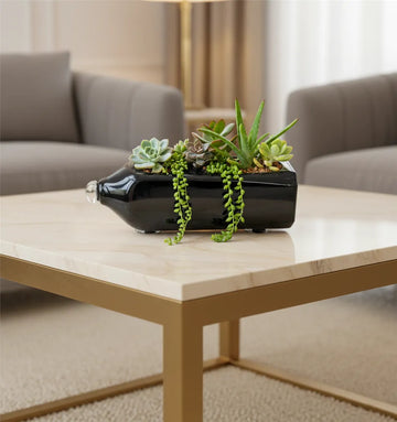 An elegant Johnnie Walker Double Black Label whisky bottle upcycled into a glass table top planter by Krystal Kraft, featuring smoothened edges, a sleek finish, and a built-in drainage outlet—perfect for sustainable home or office décor.