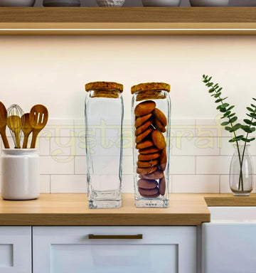 Set of two handcrafted Gold Label square glass jars with smooth finish and airtight wooden cork lids, designed by Raees Ahmed Merchant for sustainable kitchen storage.