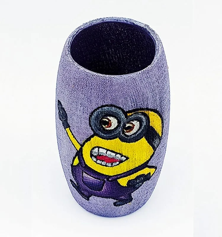 Krystal Kraft Laughing Minion bottle art made from recycled Amul glass — a handcrafted, eco-conscious mini vase or pen stand with a durable, glossy Liquitex sealant.