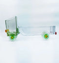 Krystal Kraft’s Green Jaunt Truck handcrafted from a recycled whiskey glass bottle – stylish truck-shaped art piece ideal for snacks, candles, or floral arrangements.