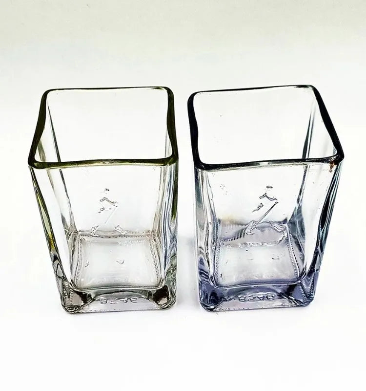 Luxurious upcycled whisky glasses featuring golden tones and elegant design.