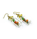 Woman wearing quirky mini glass bottle earrings – bohemian glass jewelry India