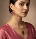 Handcrafted peach leaf glass earrings made by Indian artisan Shazia Merchant.