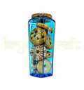 Recycled alcohol bottle transformed into an upcycled glass jar with lid