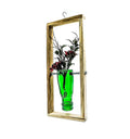 Recycled glass bottle transformed into a stylish hanging planter frame by Indian artisans at Krystal Kraft.