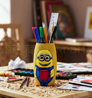 Hand-painted Smiling Minion design on a dark yellow recycled mini glass bottle with blue and red acrylic accents — a fun eco-friendly décor piece by Krystal Kraft.