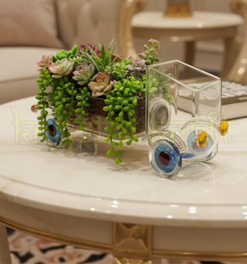 Handcrafted Speed Green Planter by Krystal Kraft, designed by Raees Ahmed Merchant from an upcycled Johnnie Walker Gold Label bottle – transparent glass truck-shaped planter perfect for succulents, herbs, and eco-friendly home décor