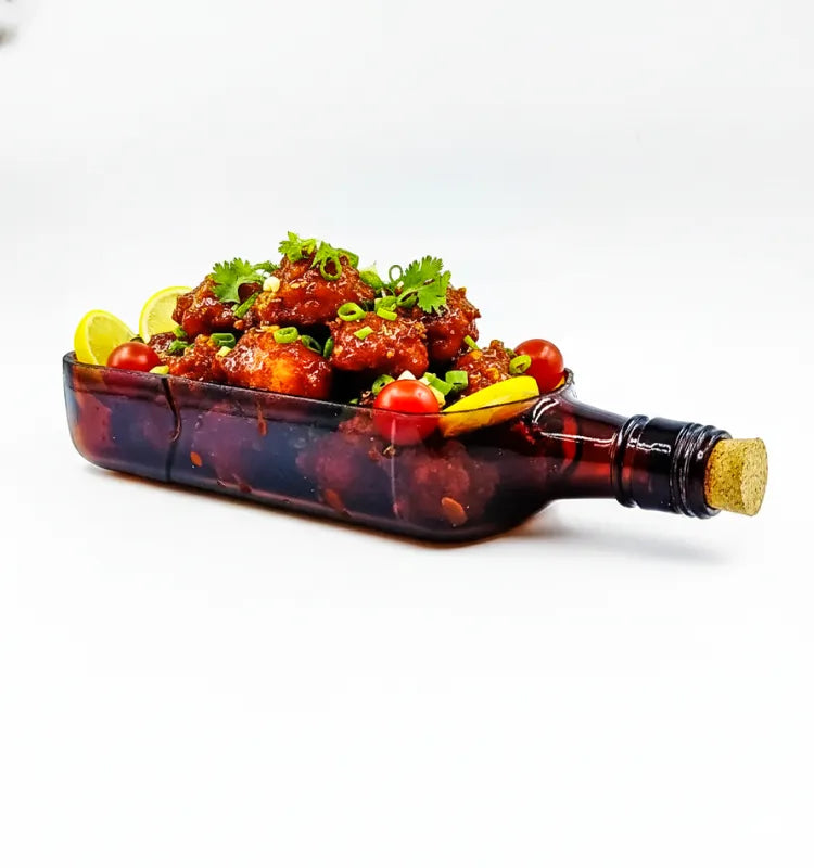 A handcrafted upcycled Ballantine bottle serving platter with a polished finish, perfect for serving cheese, snacks, and appetizers in sustainable style.