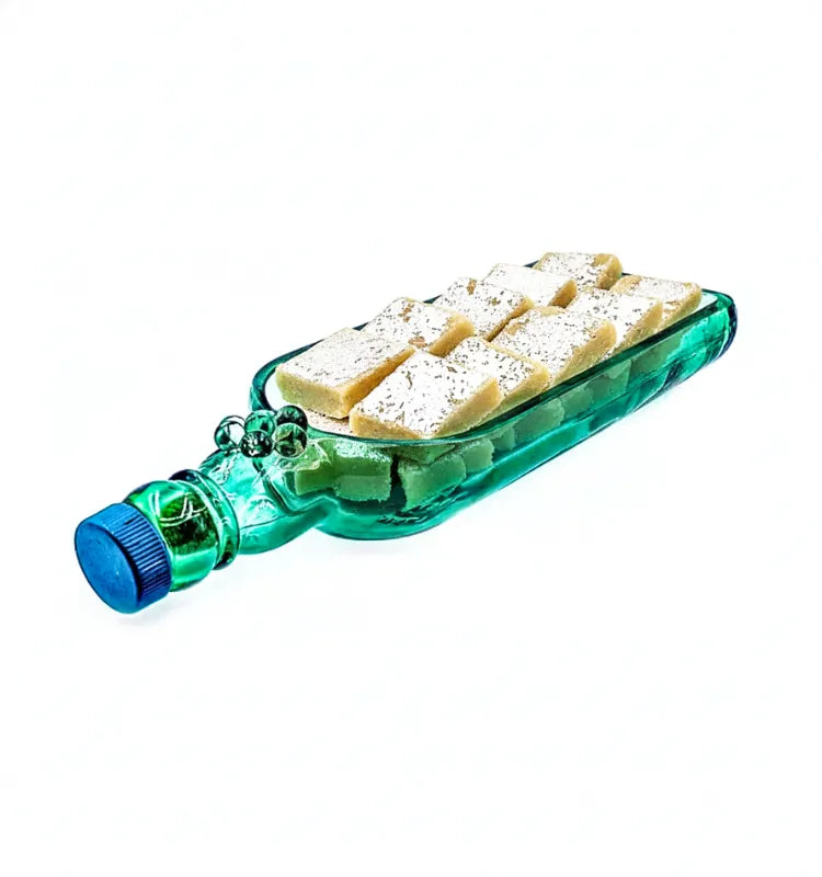 A handcrafted serving platter made from an upcycled Singleton glass bottle, featuring a polished, eco-friendly design perfect for serving appetizers and snacks sustainably.