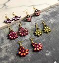 Multicolor handmade paper quilling earrings set crafted by Indian artisan Farisa Merchant for Krystal Kraft.