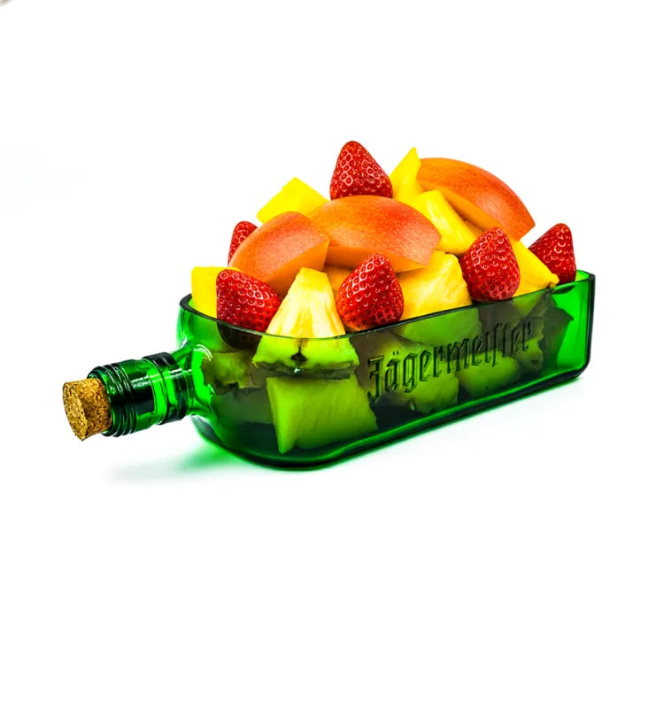 A handcrafted serving platter made from an authentic Jägermeister bottle, featuring its signature green color and logo, ideal for serving snacks and appetizers sustainably.