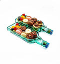 Eco-friendly Singleton bottle platters upcycled from recycled glass, handcrafted into two stylish serving trays ideal for parties, festive treats, or elegant home decor.