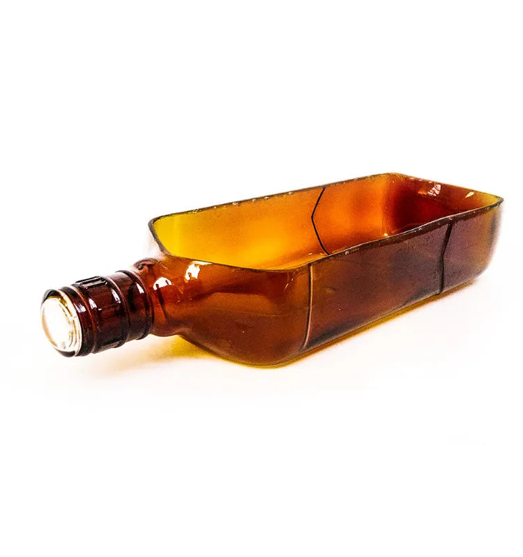 Brown bottle planter on living room shelf as eco-friendly home décor