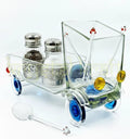 Transparent vintage glass truck décor piece by Krystal Kraft, designed by Raees Ahmed Merchant – a detailed handmade glass sculpture featuring colorful accents, ideal as a collectible, candleholder, snack server, or creative tabletop décor.
