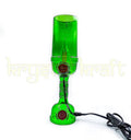 Decorative handcrafted bottle lamp made from a green Tanqueray bottle.