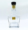 Glass canister made from repurposed Jack Daniel's bottle, filled with dry fruits.