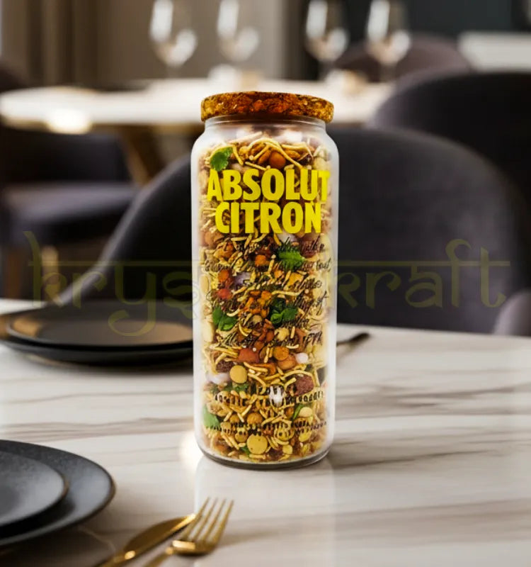 Handcrafted upcycled Absolut Citron bottle jar featuring polished glass finish and vibrant branding, perfect for eco-friendly home decor or storage use.