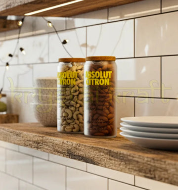 Set of two handcrafted upcycled Absolut Citron jars with polished finish and vibrant branding, perfect for eco-friendly storage or decorative display.