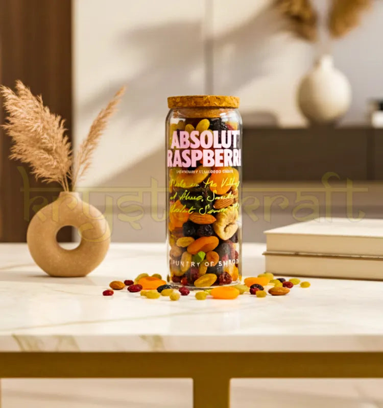 Handcrafted upcycled Absolut Raspberri jar featuring the iconic pink bottle design and smooth finish, perfect for eco-friendly home decor or gifting.