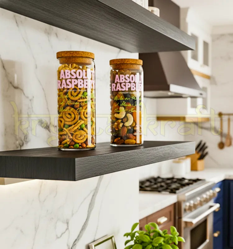 Set of two handcrafted upcycled Absolut Raspberri jars made from original bottles, featuring sleek pink branding—perfect for sustainable home decor or gifting.