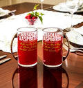 Set of two handcrafted eco-friendly mugs made from original Absolut Raspberry Vodka bottles, featuring a vibrant raspberry hue and sturdy metal handles – perfect for sustainable drinkware lovers.”