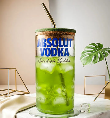 Front view of handcrafted Upcycled Absolut Vodka glass sipper featuring premium stainless steel straw and natural wooden cork.