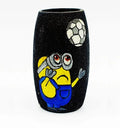 Artistic upcycled Amul mini bottle hand-painted with a football minion theme in blue and yellow tones — a durable, handmade décor accent coated with transparent Liquitex for shine.