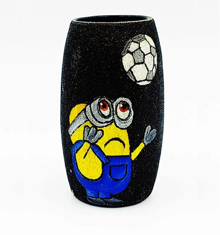 Artistic upcycled Amul mini bottle hand-painted with a football minion theme in blue and yellow tones — a durable, handmade décor accent coated with transparent Liquitex for shine.