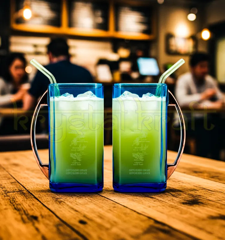 Close-up of two handcrafted upcycled Bombay Sapphire glass mugs made from recycled bottles, featuring unique blue hues and eco-friendly design by Krystal Kraft.