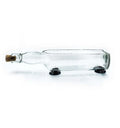 Glenlivet white bottle planter styled with green plant on office desk as upcycled home décor