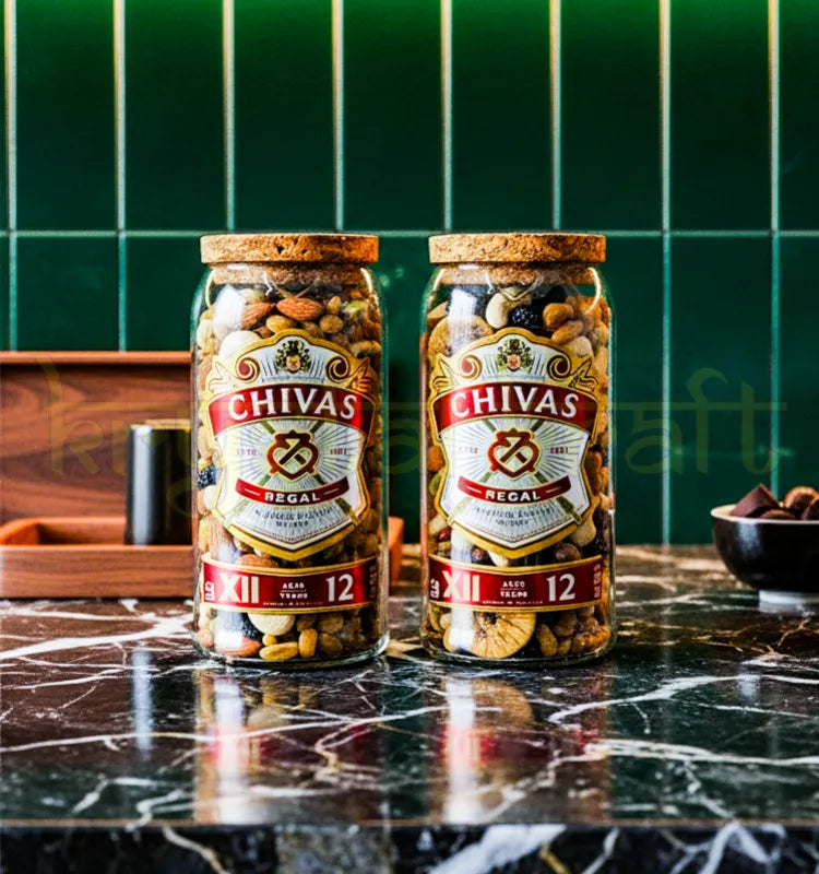 Set of two upcycled Chivas Regal jars handcrafted from original bottles, featuring preserved branding and sleek finish—perfect for eco-luxury home decor.