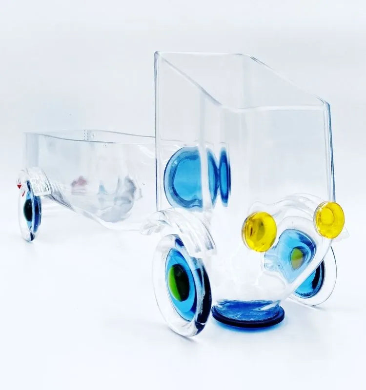 Unique gold label upcycled glass truck by Krystal Kraft, designed by Raees Ahmed Merchant, serving as a playful and sustainable snack server or creative home décor centerpiece.