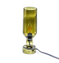 Eco-conscious table lamp made from recycled Sula wine bottle with warm LED glow, ideal for home and festive décor.