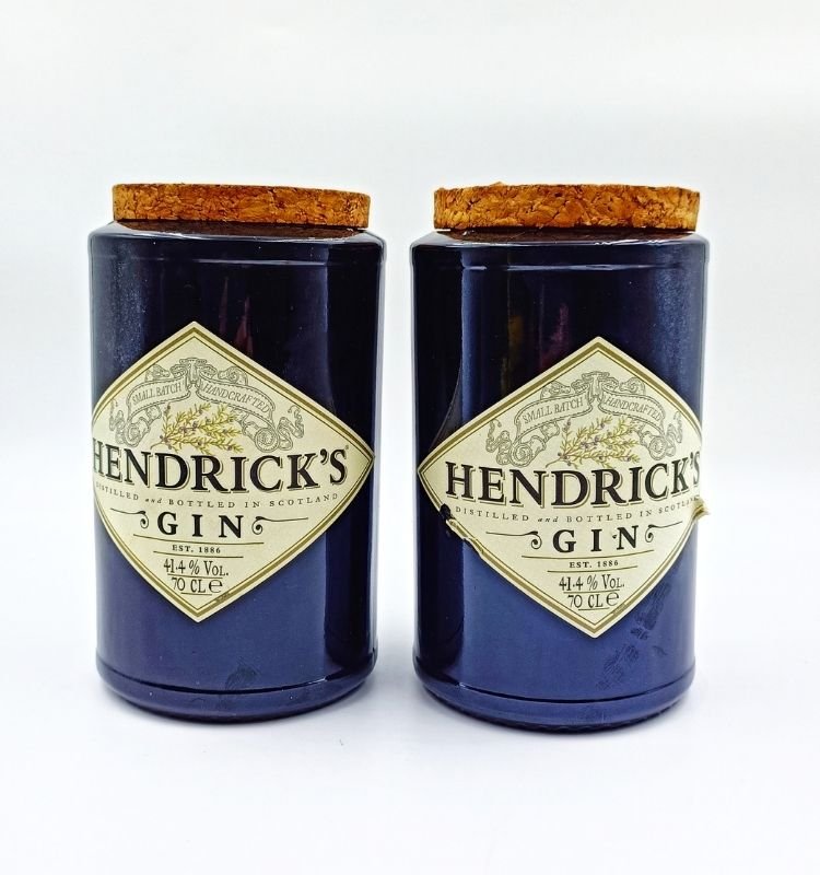 Artistic Hendrick’s-inspired upcycled glass jar set handcrafted by Raees Ahmed Merchant, featuring airtight cork lids for sustainable and elegant food storage.