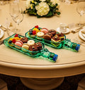 A handcrafted set of two serving platters made from authentic upcycled Singleton glass bottles, featuring unique textures and elegant design for sustainable dining and decor.