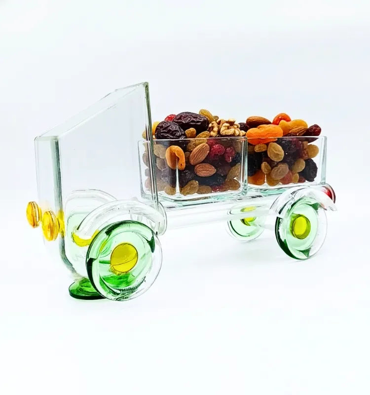 Eco-friendly upcycled glass dessert stand by Krystal Kraft, crafted from a Johnnie Walker Gold Label bottle in a tempo-shaped design, perfect for stylishly serving cupcakes, candies, and appetizers at festive gatherings.